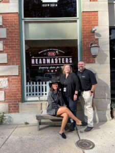 Gisselle at Headmasters Grooming Salon in Sykesville greets our team in front of her shop.