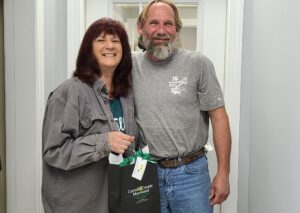 Debby and J. E. from JE Turnbaugh in Taneytown pose with their bag.