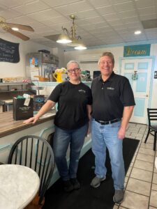 Team member Scott Singleton meets with Heather Cole, owner of Molli's Café in Westminster.