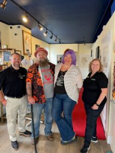 The crew at Pin it Up Acupuncture greets Denise and Stan.
