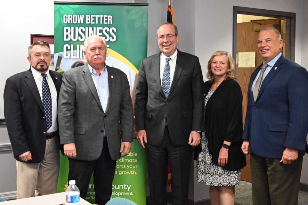 Image of Tom Barkin and several county officials