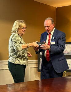 Image of Denise Beaver presenting Garrett Hoover, President, Carroll Hospital with the Pillar Award.