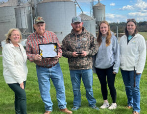 Image of Donald Lippy, Tyler Rill and Mollie Lippy receiving the Pillar Award.