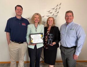 Image of Dr. Julia Jasken and Economic Development Staff with the McDaniel Pillar Award